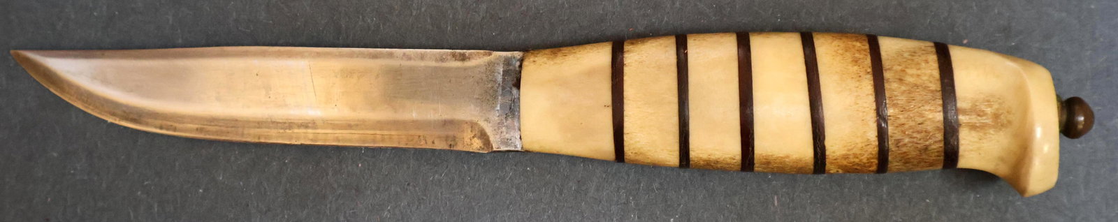 J & J Helle Norway Bone w/ Matching Embossed Leather Scabbard: J & J Helle Norway Bone with matching embossed leather scabbard 3 5/8 inch blade 3 3/4 inch handle Knife and scabbard are hand crafted and one of a kind. No factory