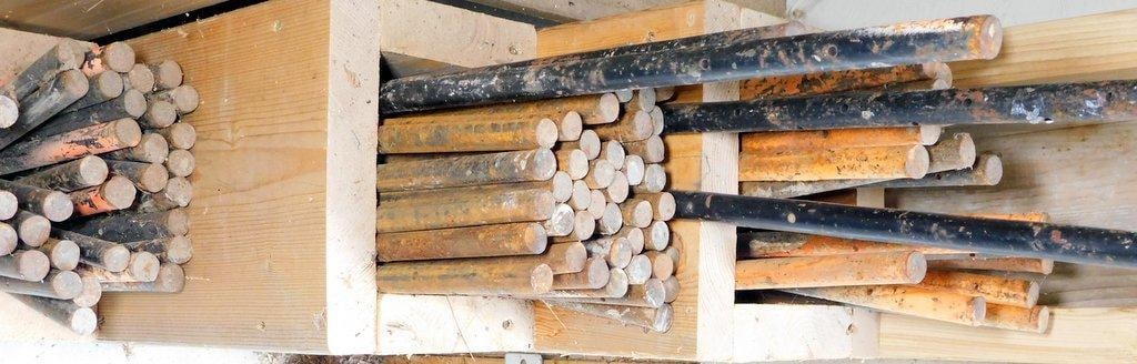 Steel Concrete Form Stakes: Steel Concrete Form Stakes of varying lengths, primarily black and rust-colored Very good used condition Dimensions range up to approximately 36 inches in length Ready for your next form work project