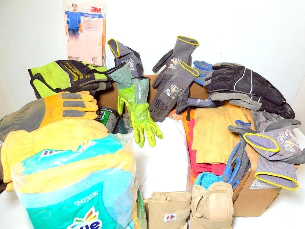 Large Grouping of Work Gloves, Cleaning Supplies, and Protective Equipment Bundle: An assortment of used work gloves from brands like Wolverine and Mechanix Wear, microfiber cleaning cloths (24 ct package), packs of steel wool (#2 medium coarse grade), protective wrist wraps, and va