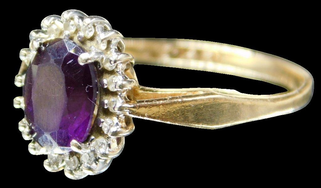 14K Gold Ladies Ring w/ Diamonds and Amethyst: Beautiful yellow gold ring Amethyst center stone surrounded by diamonds Shows so very well Marked 14K Size 6.5 1.80 dwt
