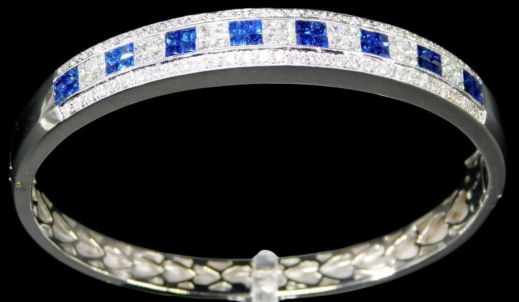 18K Gold, Diamond, and Sapphire Bracelet: Gorgeous jewelry, as fine an example as you will find This stunning 18K white gold bracelet is adorned with diamonds and sapphires Brilliant, shiny and ready to impress Stamped 750 as shown 2 1/4