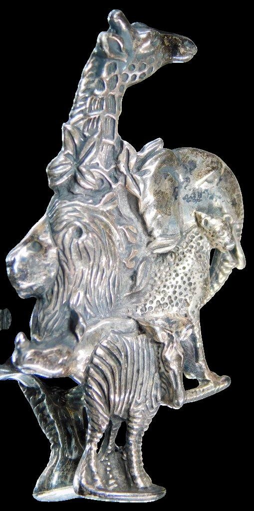 Sterling Silver African Wildlife Pendant: Finely detailed grouping of African wildlife Shows well Tested Sterling non-magnetic Marked as shown, illegible to us 2 inches T 11.45 dwt