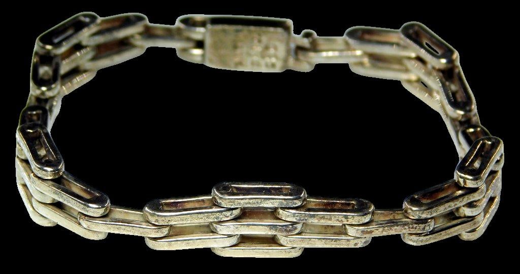 Mexican Sterling Silver 925 Chain Bracelet Marked TL-5: Mexican sterling silver chain bracelet marked 925 TL-5 Mexico, indicating it is made of 92.5% silver The bracelet features rectangular links with a secure clasp Construction shows light general wear