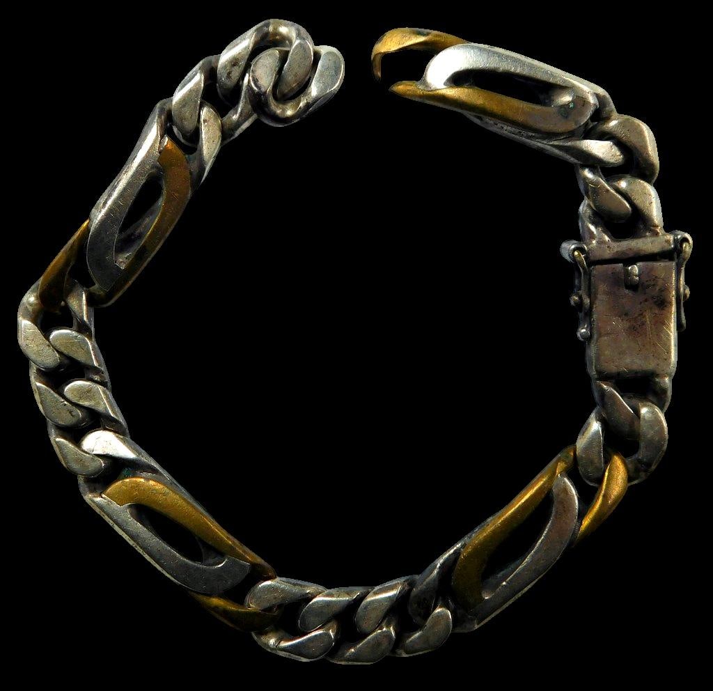 Sterling Silver and Gold-Toned Link Bracelet: Sterling silver bracelet featuring alternating links with gold-toned accents The piece includes a secure clasp mechanism with visible hallmarks indicating 925 and an unverified maker's mark The bracel