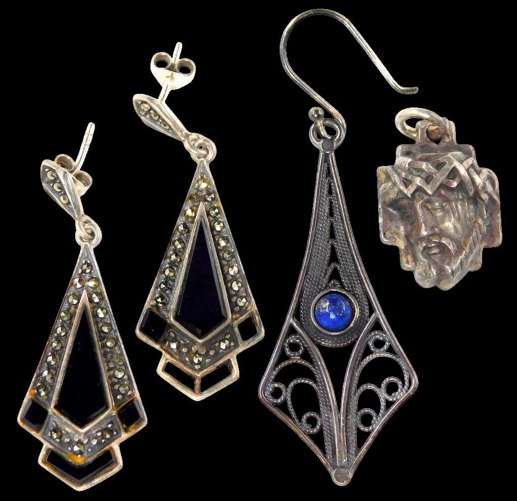 Sterling Silver Jewelry Including Earrings and Pendant: This lot includes sterling silver jewelry pieces Featured are a pair of Art Deco-style earrings marked 925 with black enamel and marcasite accents, with one missing stones as shown, one sole filigree