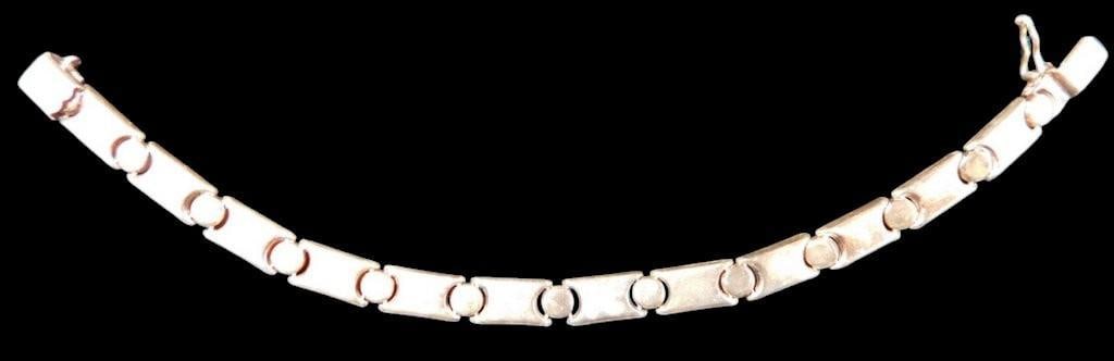 Sterling Silver Precious Precious TM Bracelet w/ Rectangular Links: Sterling silver bracelet featuring rectangular links alternating with circular connectors, marked Precious Precious TM 925 on the clasp The design showcases a combination of polished rectangular and