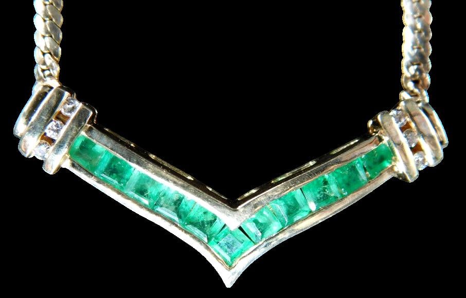 14K Gold V-Shape Necklace w/ Emerald and Diamond Accents: 14K gold V-shaped necklace featuring a channel setting with square-cut green emerald stones Accented with round-cut diamonds on either side of the center design The necklace is stamped 14K and ADL on