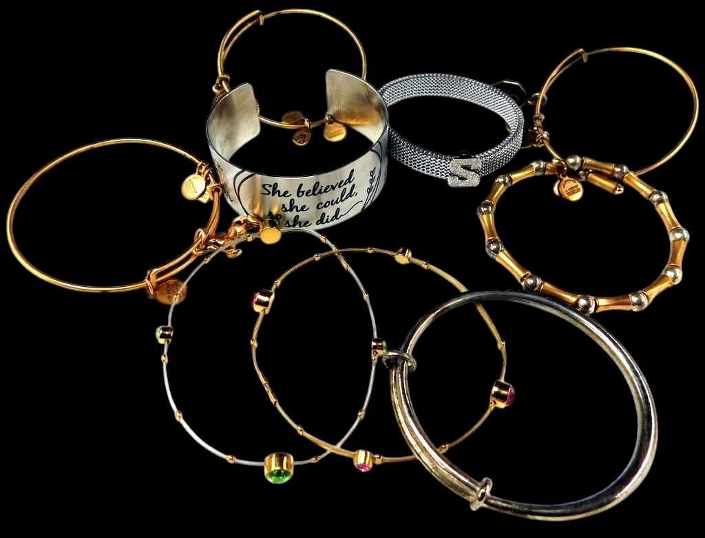 Bracelet Hoop Bangles Mixed-Metal Bracelets w/ Various Decorations: Mixed-metal bracelets, consisting of bangles and cuffs Features include a silver-tone cuff engraved with She believed she could, so she did, a mesh bracelet with crystal S design, and multiple gold-to