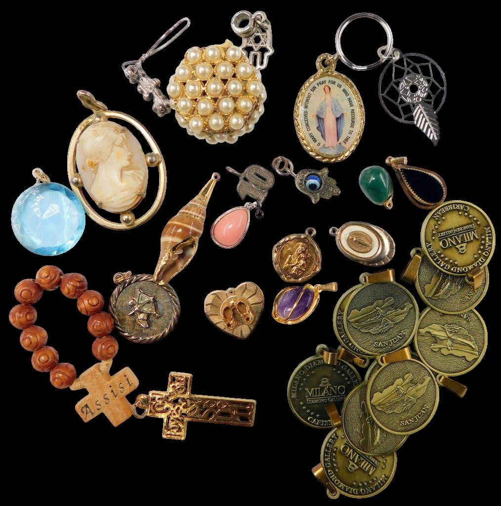 Jewelry and Medallions Grouping Including Pendants, Charms, and Rosary: Various jewelry items including a cameo pendant, pearl cluster ornament, large blue crystal-like pendant, religious charms including a wooden Assisi rosary and cross, Milano medallions, and several