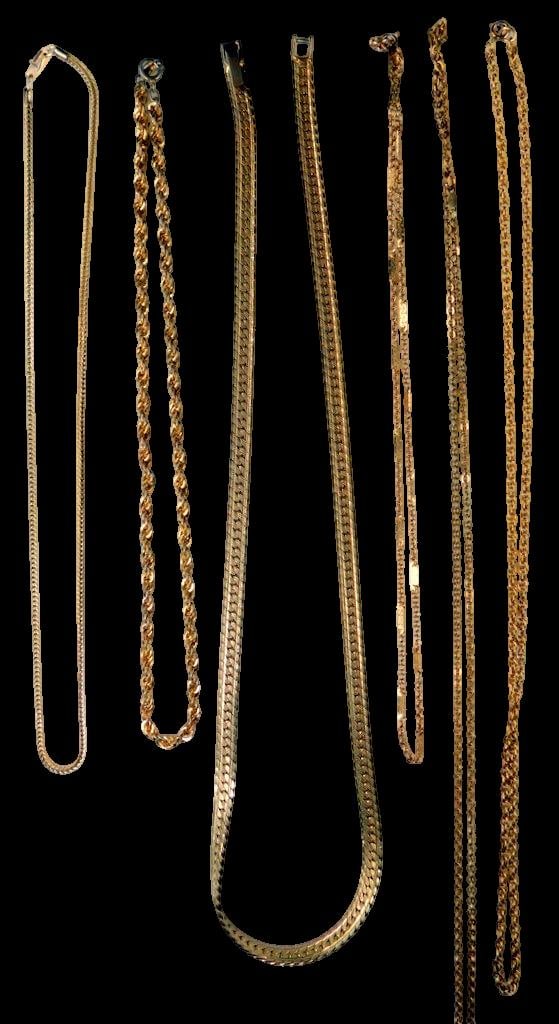 Seven Gold-Tone Chain Necklaces in Various Styles: Seven gold-tone chain necklaces featuring different designs, including rope, snake, and box link styles Each chain varies in length and style, with secure clasps for wearability Made of gold-tone