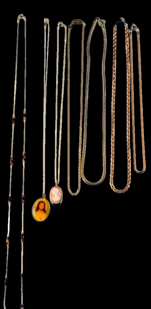 Gold-Tone and Beaded Necklaces w/ Religious and Cameo Pendant Charms: Costume necklaces featuring gold-tone chains, including snake and rope types Includes two pendant charms: a religious image and a cameo profile One necklace showcases beaded accents in amber and burgu
