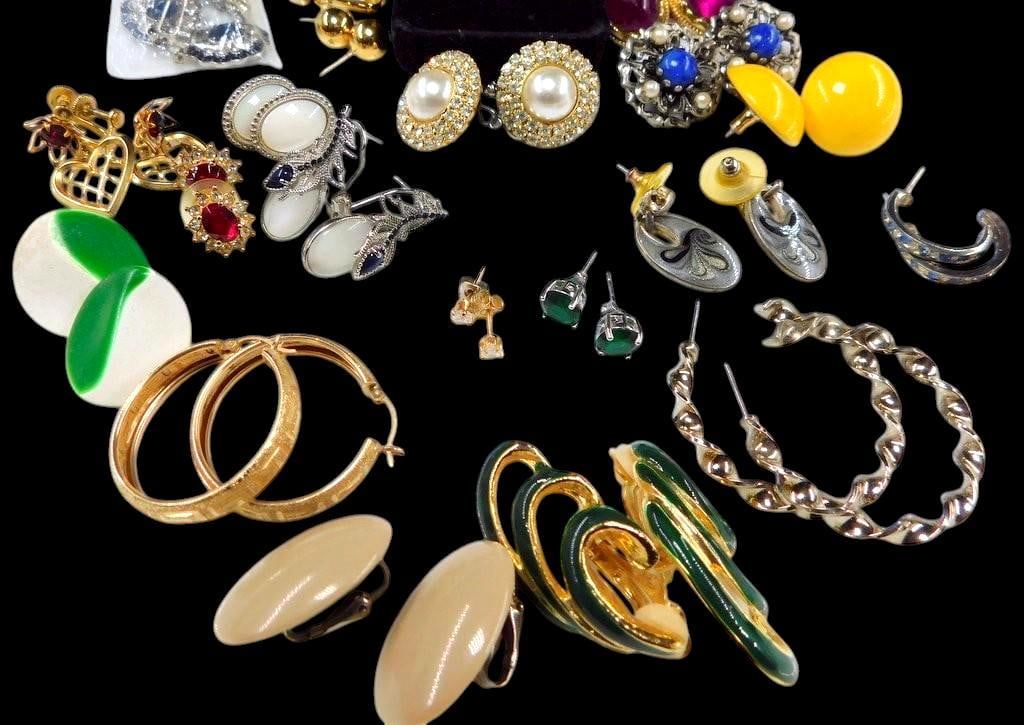 Costume and Fashion Earrings in Various Styles and Materials: Post and clip earrings A varied collection of costume and fashion earrings featuring hoop, stud, clip-on, and dangle styles Includes materials such as metal, enamel, acrylic, and faux pearl Designs