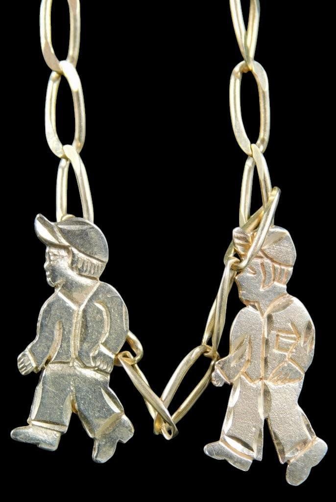 18K Gold Pendant Necklace w/ Figaro Chain and Two Boy Charms: 18K gold necklace featuring a Figaro link chain and two charms depicting boys in etched designs Both charms are engraved on the reverse with names Justin and Alex and dates as shown, providing persona