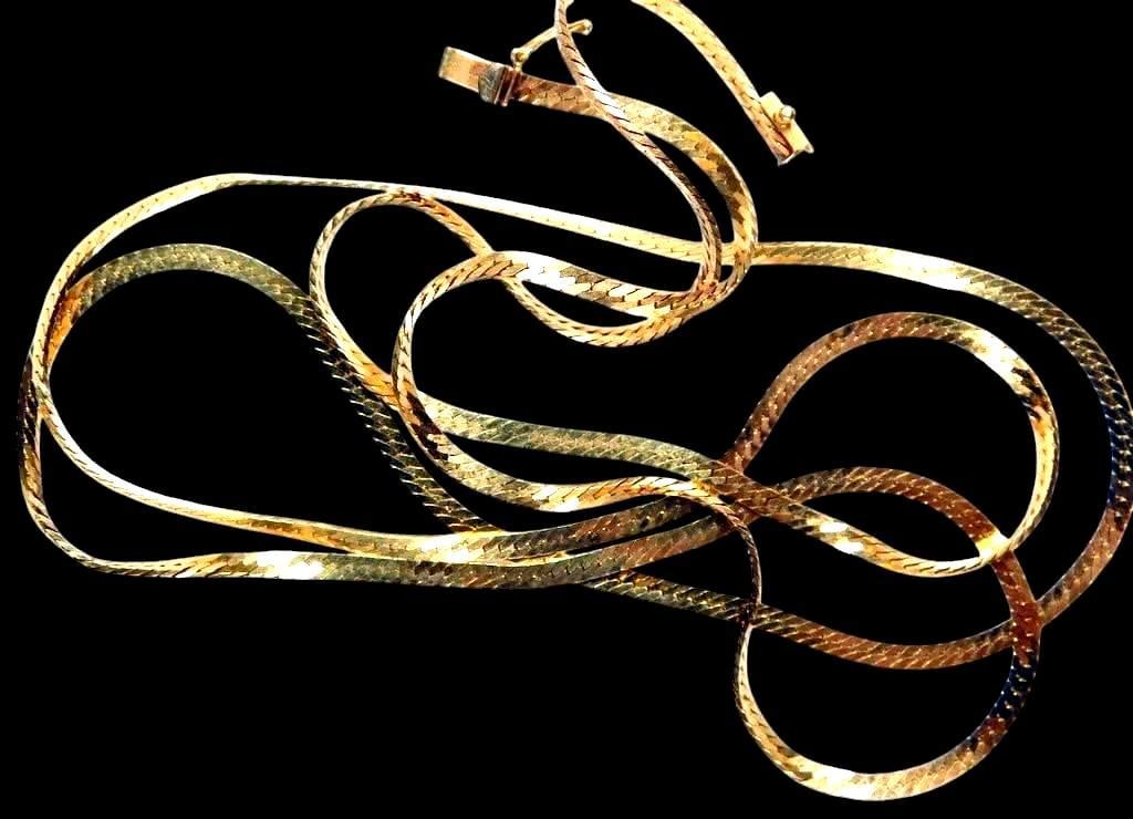 14K Yellow Gold Flat Chain Necklace, 30 Inches Long: 14K yellow gold flat chain necklace with a herringbone-style design The chain measures 30 inches in length and is secured with a fold-over clasp Stamped 14K on the clasp, confirming its gold purity Th