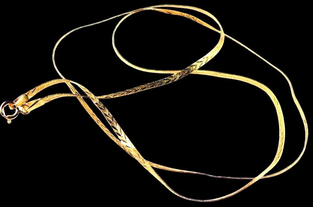 14K Gold Necklace w/ Textured Chevron Pattern: Elegant gold necklace featuring a textured chevron pattern along its length The chain is equipped with a secure spring ring clasp marked 585, indicating 14K gold purity The necklace showcases