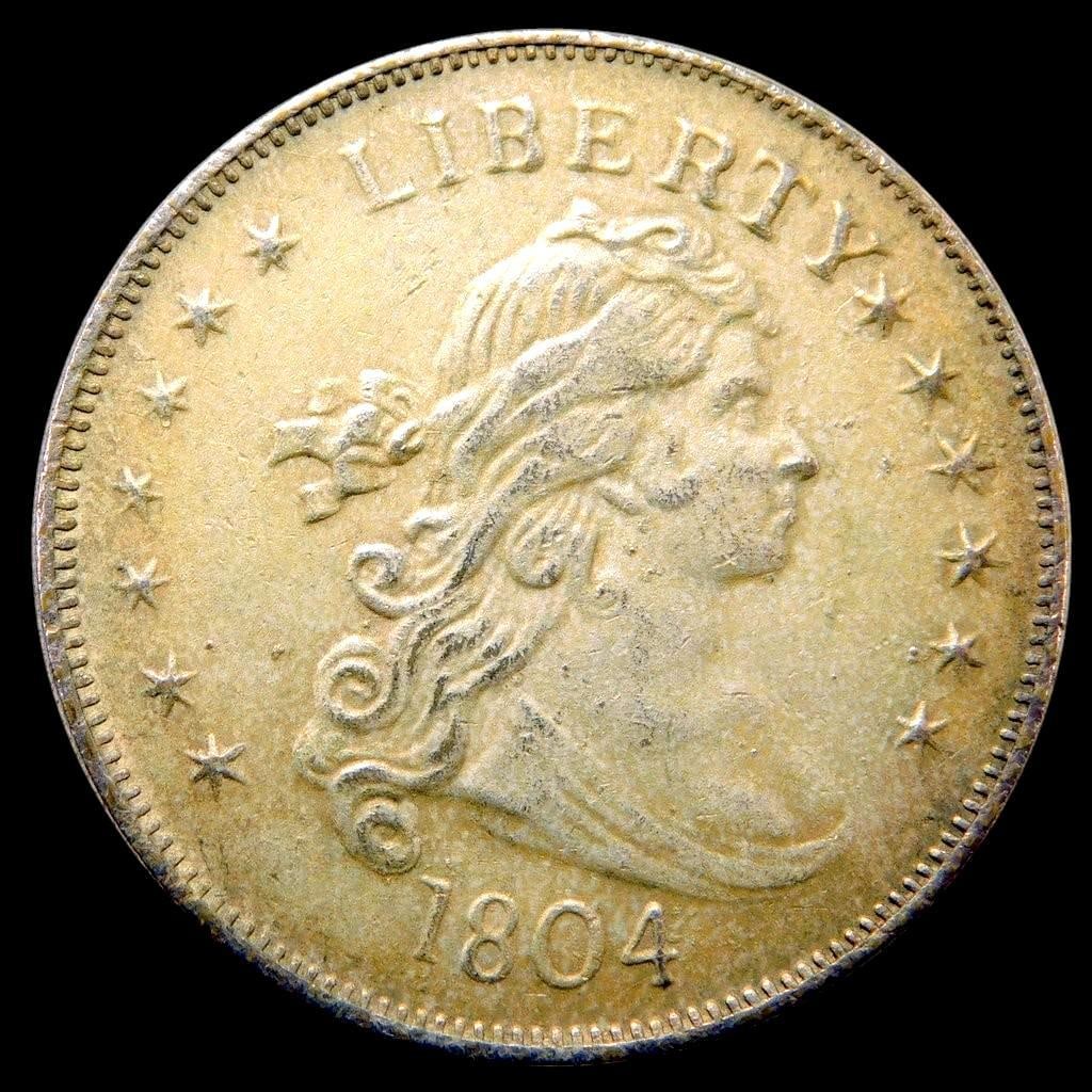 1804 Liberty Dollar Coin, Draped Bust Design, Copy: Not an original of course Is not magnetic when tested 1804 Liberty silver dollar coin featuring the Draped Bust design on the obverse and the heraldic eagle on the reverse Overall condition appears