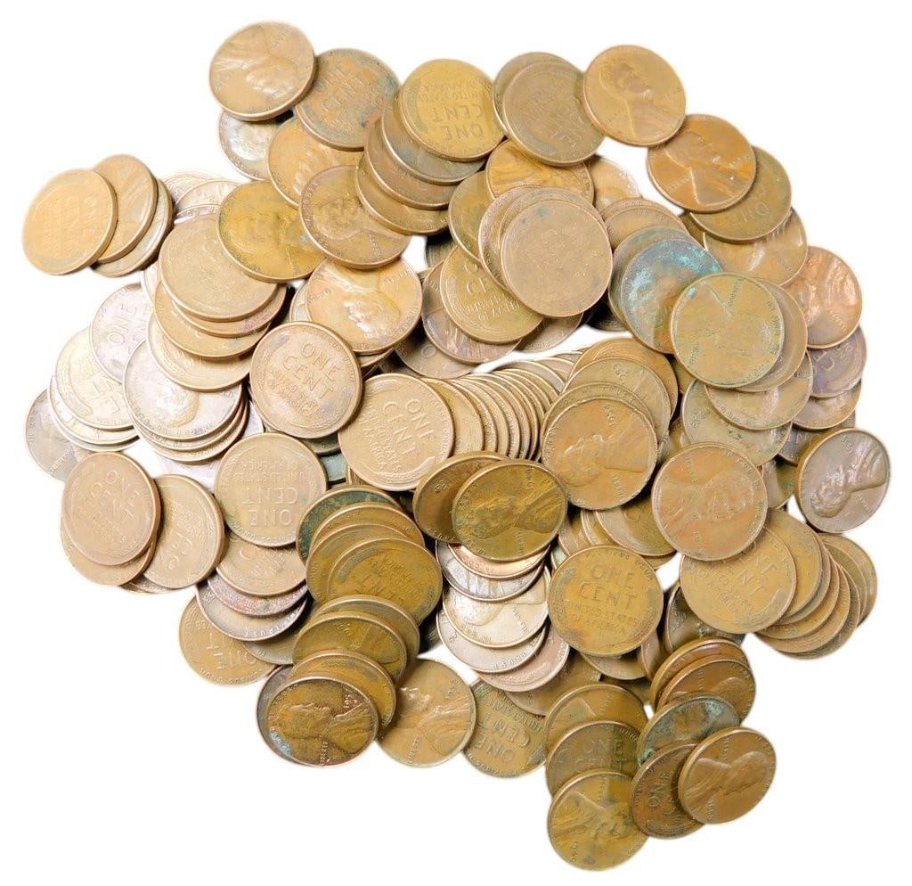 Pile of U.S. Wheat Pennies - Assorted Dates and Mint Marks: U.S. Wheat Pennies featuring various dates and mint marks are unsearched by us These one-cent coins, minted primarily between 1909 and 1958, display the iconic wheat reverse design Most coins exhibit 