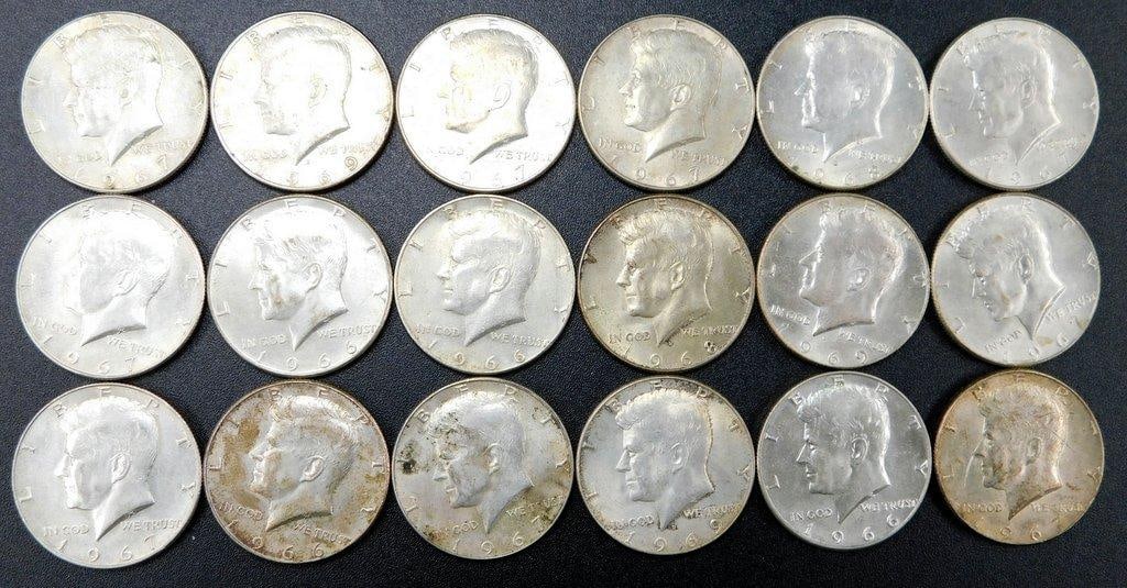 18 Kennedy Half Dollars (1964-1969) - Mixed Dates and Conditions: 18 Kennedy half dollars, featuring dates ranging from 1964 to 1969 Coins are made of silver alloy (90% silver for 1964; 40% silver for 1965-1969) and display varying circulation wear Some coins exhibi