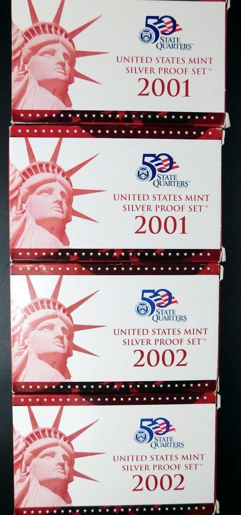 United States Mint 2001 and 2002 Silver Proof Quarter Sets, 4 Sets: Four United States Mint Silver Proof Quarter Sets from 2001 and 2002, featuring coins from the 50 State Quarters series Each set comes in original packaging The coins are made of 90% silver and contai