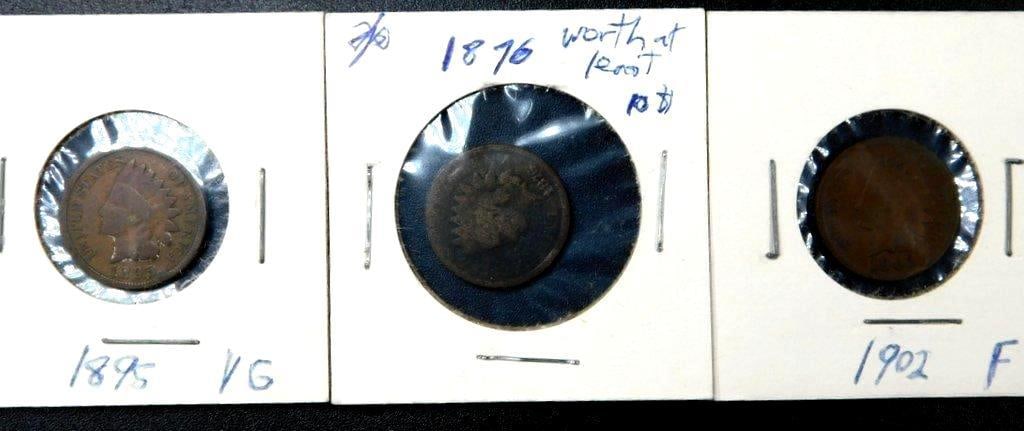Three U.S. Indian Head Cents: 1895, 1876, and 1902: Three U.S. Indian Head one-cent coins, including an 1895 coin graded as VG (Very Good), an 1876 coin, and a 1902 coin graded as F (Fine) Varying degrees of circulation wear Not graded by us Mounted in