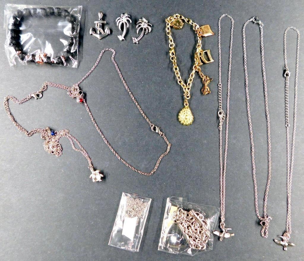 Fashion Jewelry Including Necklaces, Bracelets, and Charms: Fashion jewelry including necklaces, bracelets, and charms featuring a variety of designs such as palm trees, anchors, and hearts. Includes items with silver and gold tones as well as beadwork Some ch
