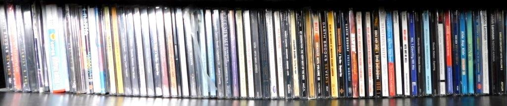 Grouping of Music CDs w/ Varied Artists and Genres: Extensive collection of CDs featuring various music artists and genres Includes titles from Garth Brooks, Billy Joel, Rod Stewart, Ricky Martin, and more, along with themed collections like Greatest