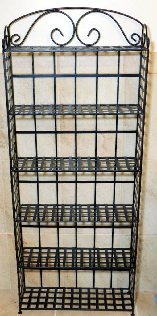 Black Metal Five-Tier Freestanding Shelf w/ Scroll Design: Five-tier freestanding shelving unit constructed from black metal with a grid-tier design and decorative scrollwork at the top Suitable for various storage or display purposes Features a sturdy frame 