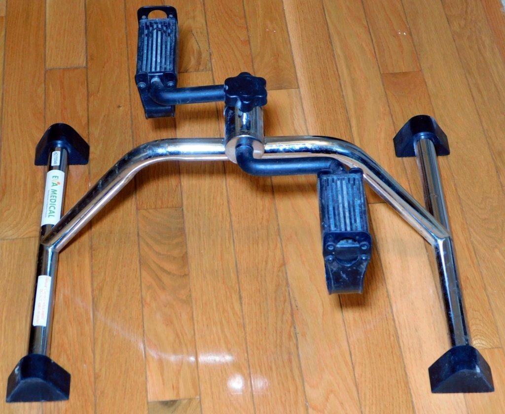 Eva Medical Pedal Exerciser w/ Adjustable Resistance: Eva Medical pedal exerciser designed for individuals needing low-impact physical activity or rehabilitation Made of metal with a chrome finish, the device features two pedals with textured grips and