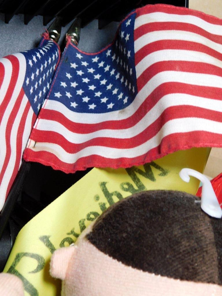 Collectibles, Art Supplies, and Memorabilia Grouping: Assortment including a plush figure, an ARMY baseball cap, U.S. flags, posters featuring Iron Man and Elvis (Black Leather theme), various art supplies such as an 11 x 14 canvas, LeapPad, notebooks, a