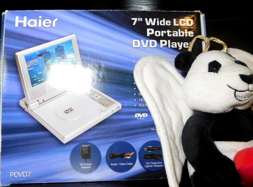 Items Including Haier Portable DVD Player, Plush Toys, and Home Decor - 2