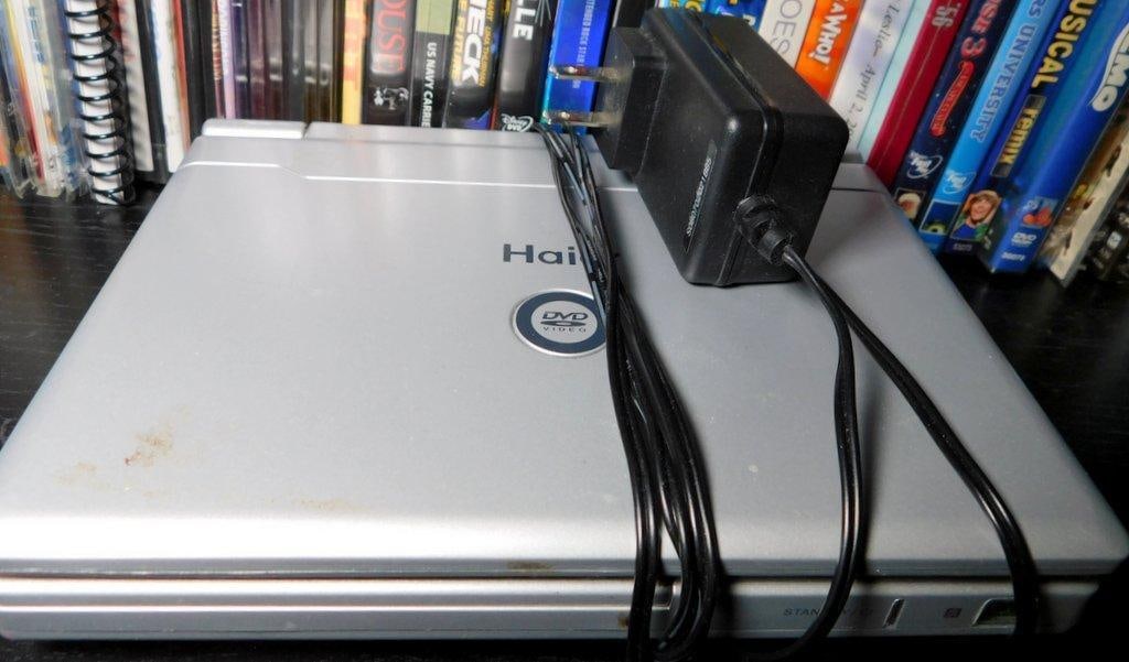 Items Including Haier Portable DVD Player, Plush Toys, and Home Decor - 3
