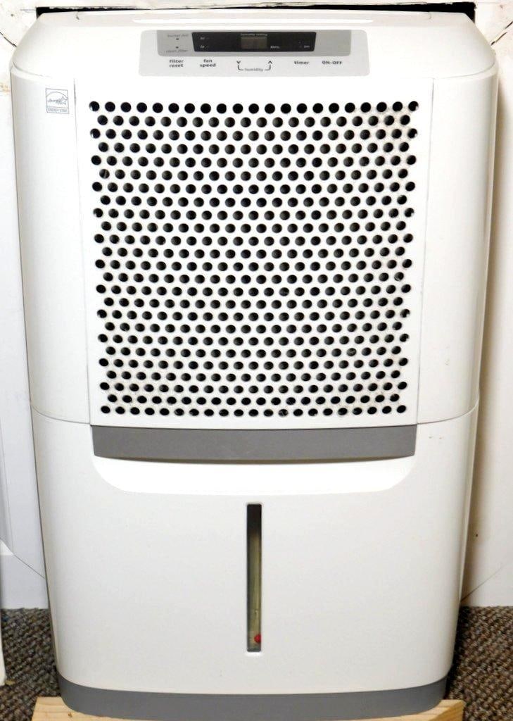 Frigidaire and GE Dehumidifiers, (2): Two used dehumidifiers: a Frigidaire model featuring a digital humidity setting panel and filter/full bucket indicators, and a GE model with internal pump functionality, fan speed control, and a
