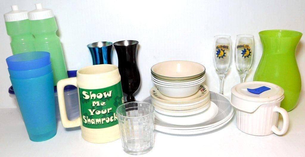 Glasses, Mugs, Plates, and Kitchenware Bundle: A variety of kitchenware items, including two green plastic water bottles, two blue plastic tumblers, a cream-colored mug with shamrock-themed text, one glass tumbler, two metallic vases in blue and