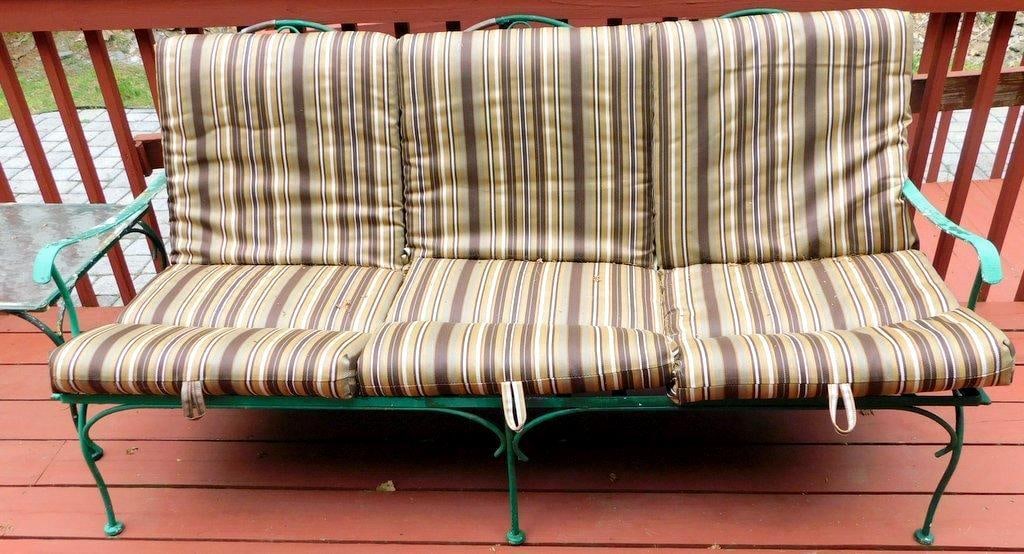 Metal Patio Furniture Set w/ Glass-Top Table and Cushions: Patio furniture set includes a three-seat sofa with striped cushions, two matching armchairs with striped cushions, a glass-top table, and two additional chairs with cushions Also includes small metal