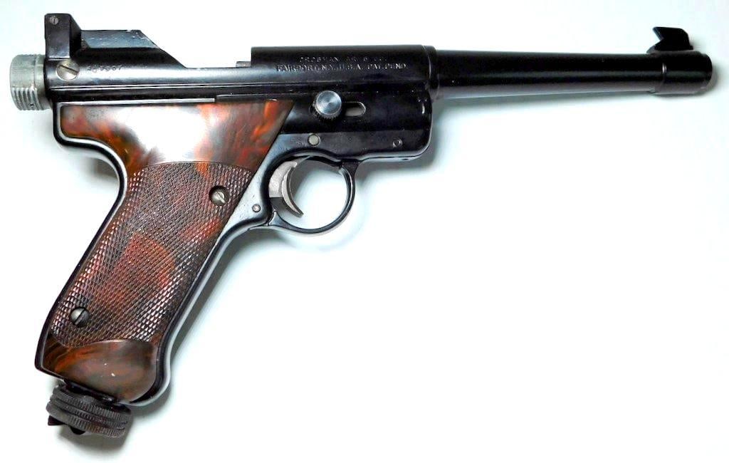 Crosman Mark I Target .22 Caliber Pellet Air Pistol w/ Accessories: Crosman Mark I target air pellet pistol, .22 caliber, manufactured in Fairport, NY by Crosman Arms Co. Features black metal construction with checkered dark plastic grips Includes original manuals, pe