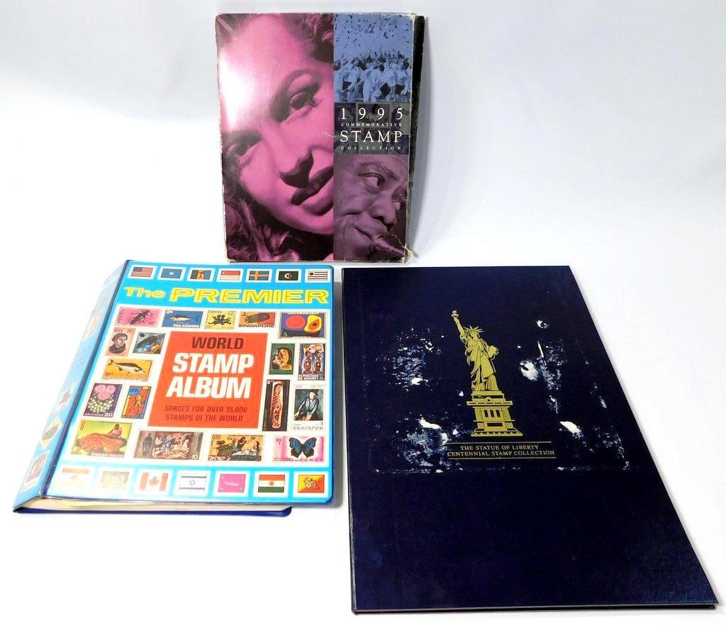 1995 Commemorative Stamp Collection, Statue of Liberty and Premier World Stamp Album: A 1995 commemorative stamp collection with U.S. stamps mounted on dedicated pages, showing minor wear to the cover Also includes The Premier World Stamp Album featuring international stamps from