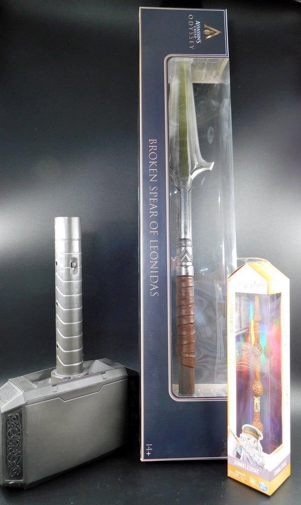 (Lot of 3) Replica Props from Marvel, Assassins Creed and The Wizarding World: (Lot of 3) Replica Props from Marvel, Assassins Creed and The Wizarding World Marvel, Thor's Hammer - The large hammer is a multifaceted collectible. Assassin's Creed Odyssey - Broken Spear