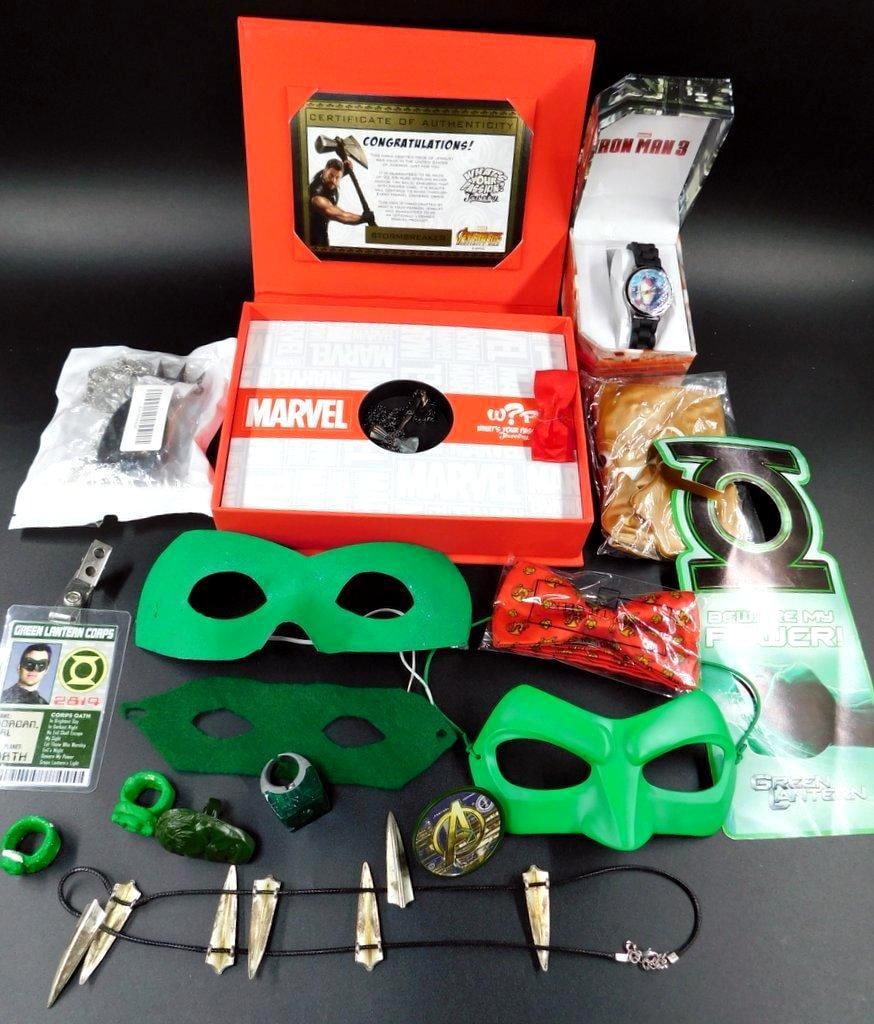 Marvel and Green Lantern Collectible Lot w/ Jewelry and Watch: A Thor Stormbreaker necklace with a certificate of authenticity, an Iron Man 3 analog watch, two Green Lantern-themed masks, a Green Lantern Corps badge, replica power rings, and dagger necklace 