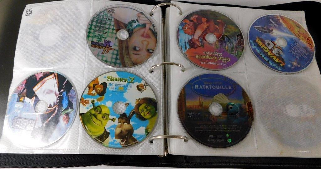 Binder of Loose DVDs -Comedy, Action, Children's Movie Collection & Empty DVD Cases - 3