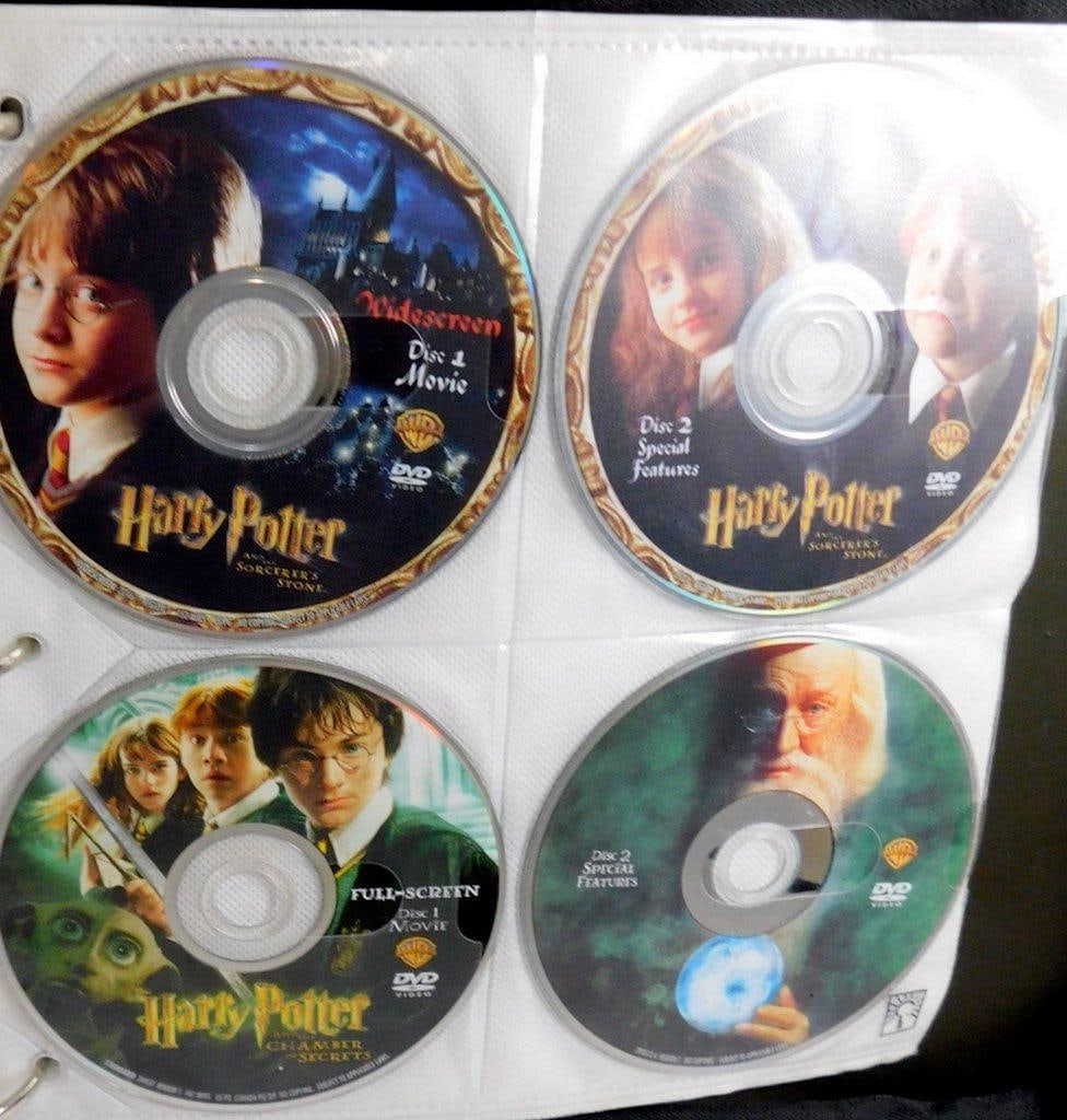 Binder of Loose DVDs -Comedy, Action, Children's Movie Collection & Empty DVD Cases - 5