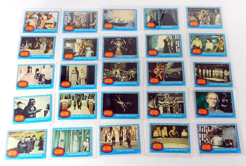 (Lot of 25) Collection of 1977 Topps Star Wars Blue Series 1 Trading Cards: (Lot of 25) Collection of 1977 Topps Star Wars Blue Series 1 trading cards Released alongside Star Wars: Episode IV A New Hope 25 trading cards featuring film stills, captions, and the distinctive