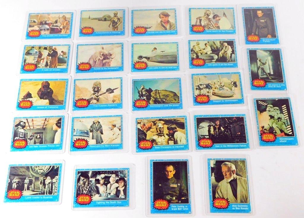 (Lot of 23) 1977 Topps Star Wars Series 1 Trading Cards: (Lot of 23) 1977 Topps Star Wars Series 1 trading cards. The selection features several early story-beat cards, including #12 "The droids are reunited!", #17 Lord Vader threatens Princess