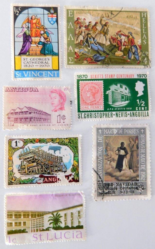 (Lot of 7) Vintage Caribbean and Latin American Postage Stamps: Seven vintage postage stamps from the Caribbean and Latin America, each depicting unique themes such as historical anniversaries, local industries, and regions Countries represented include St.