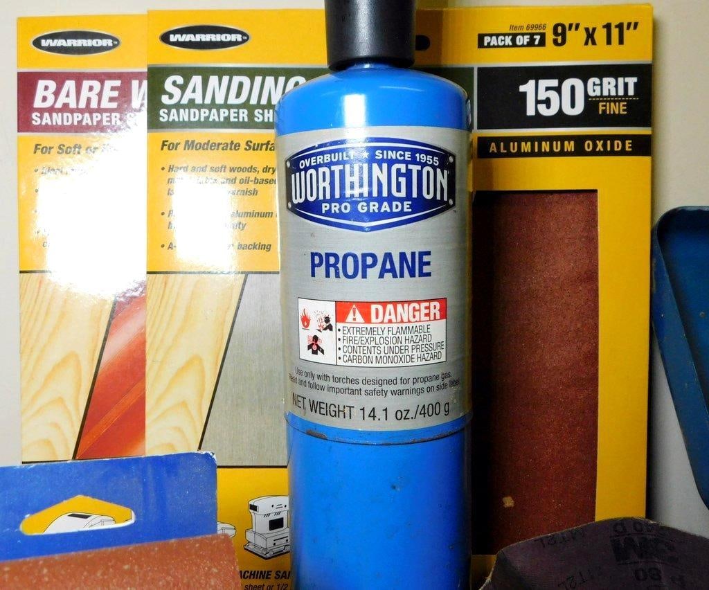 Workshop Tools and Supplies Including Sandpaper, Propane Canister, and Toolbox - 2