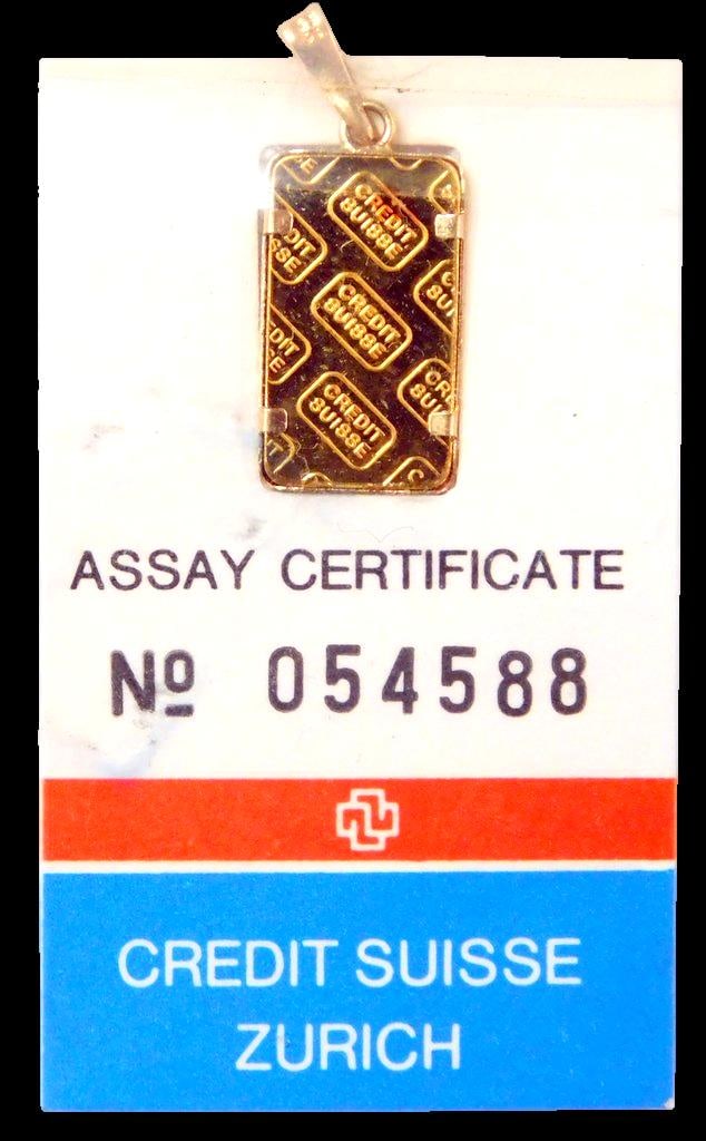 Credit Suisse 1g Fine Gold Pendant w/ Assay Certificate: Credit Suisse fine gold pendant featuring 1 gram of 999.9 purity gold Swiss gold bar is also encased in a 14K yellow gold jewelry bezel frame that adds to the value Produced by Valcambi S.A., it 