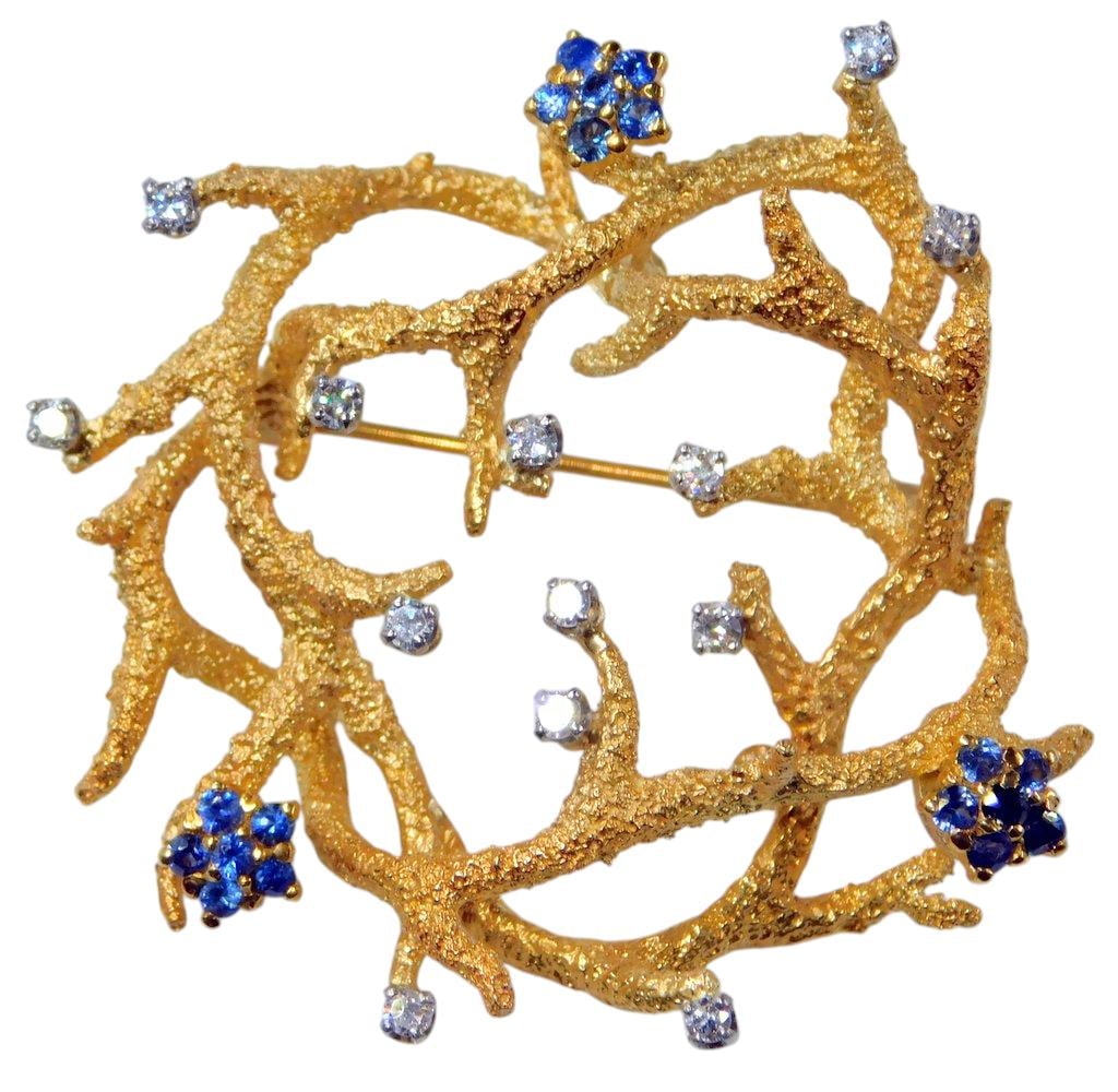 La Triomphe 18K Gold Brooch w/ Sapphires and Diamonds: Beautiful collectible jewelry created by Astoria Jewelry Manufacturing Company of Long Island, New York Signature La Triomphe 18KT yellow gold brooch features a textured openwork branch