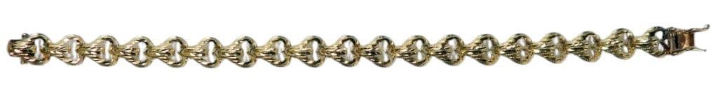 14K Arts Elegance Gold Bracelet: A 7-inch bracelet crafted from 14K gold The clasp features a hallmark displaying 14K and additional Arts Elegance maker's marks, ensuring its authenticity and quality The bracelet features a link