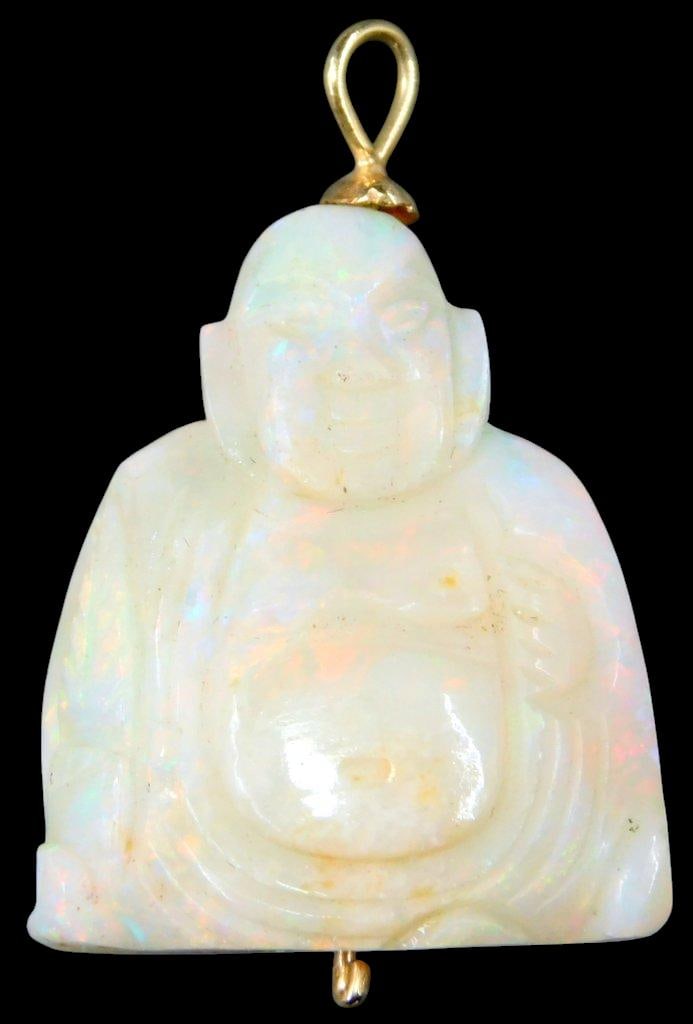 Carved Opal Buddha Pendant w/ 14K Gold Bale: Pendant featuring a hand-carved Buddha figure made from opal, notable for its iridescent play-of-color The piece includes a 14K gold tested bale for hanging, with attachment points at the top and