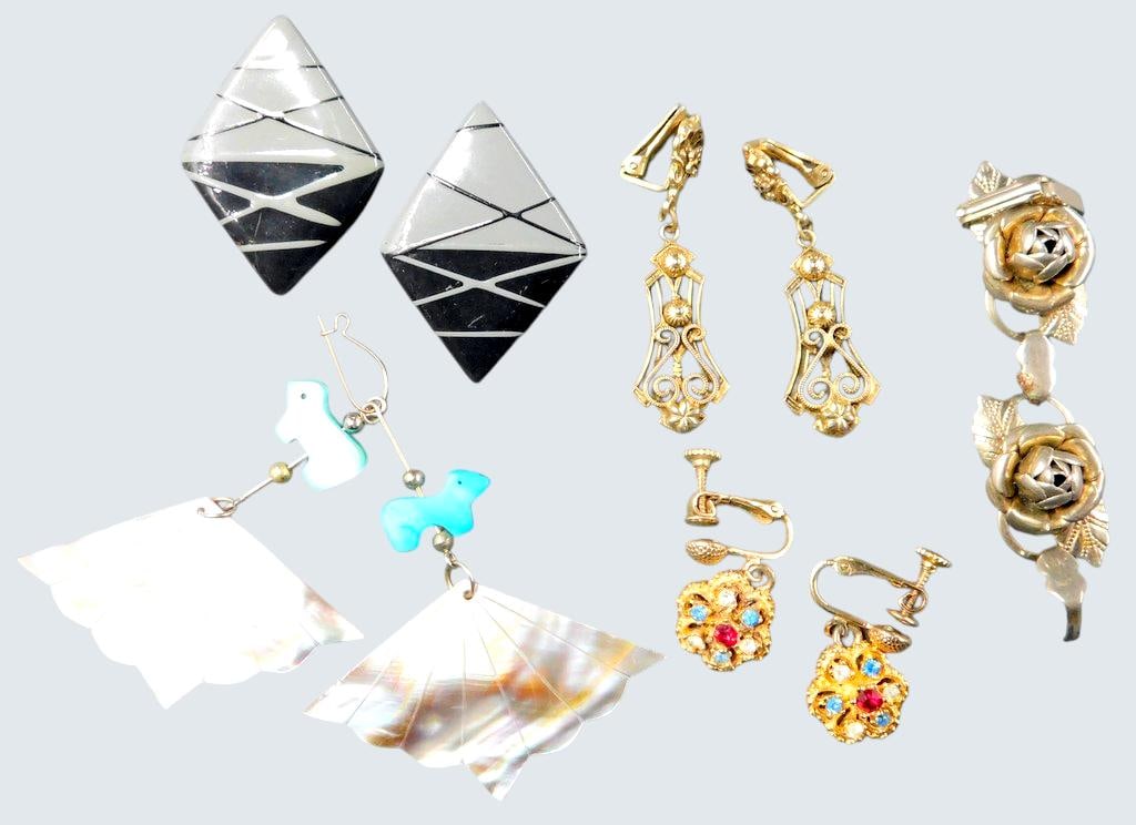 Vintage and Modern Earrings and Floral Brooch Grouping: A mix of vintage and modern jewelry pieces Features a pair of diamond-shaped black and white earrings, dangling earrings with carved turquoise-colored animals and mother-of-pearl accents, gold-tone