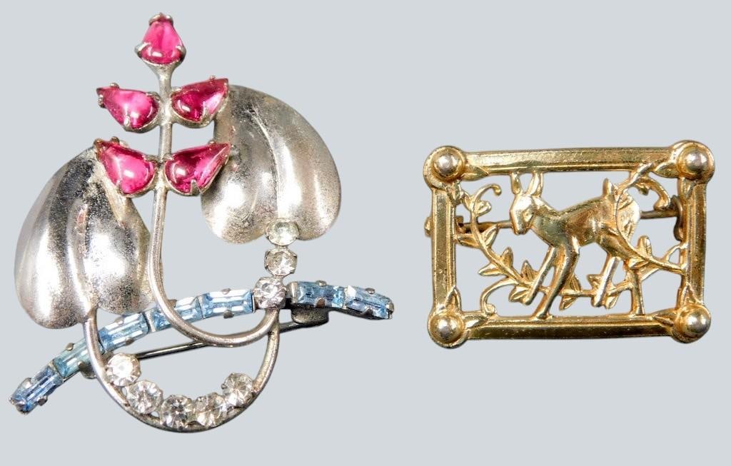 Sterling Silver Flower and Deer Brooches, (2): Two brooches, both marked Sterling The first features a floral motif with pink glass stones and blue/clear accents, marked Sterling CA The second is rectangular with a deer and vine design,